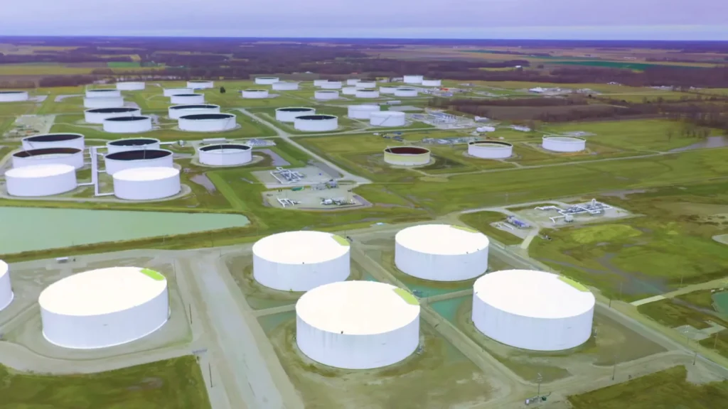 Aerial view of white storage tanks set in farmland