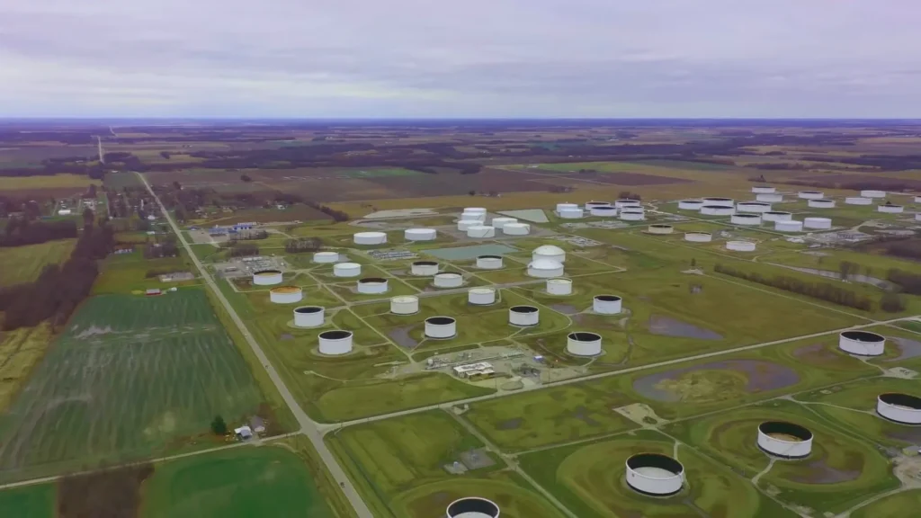 Wide aerial view of tank farms spread across farmland