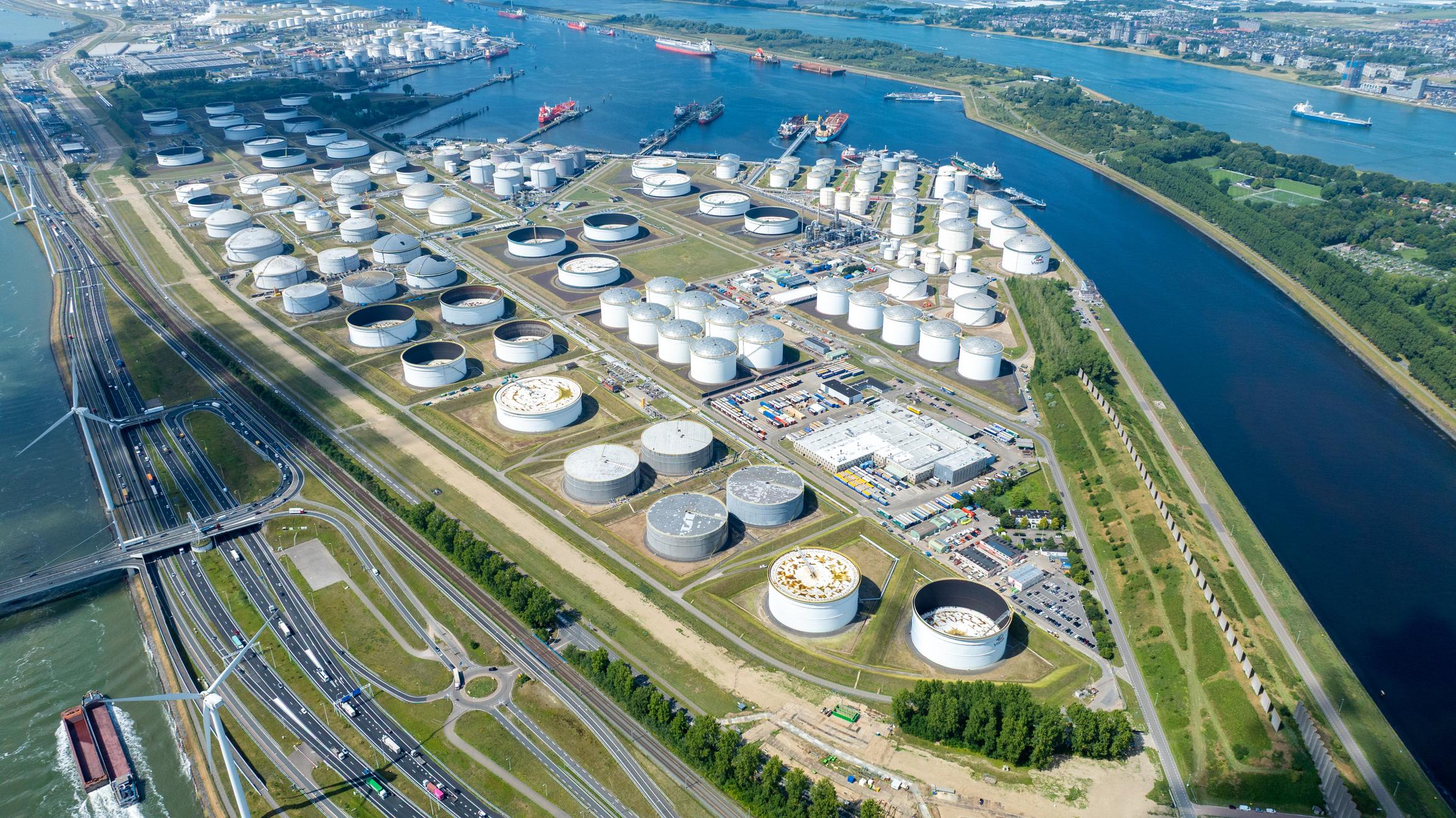 Large steel oil storage tanks at an energy terminal